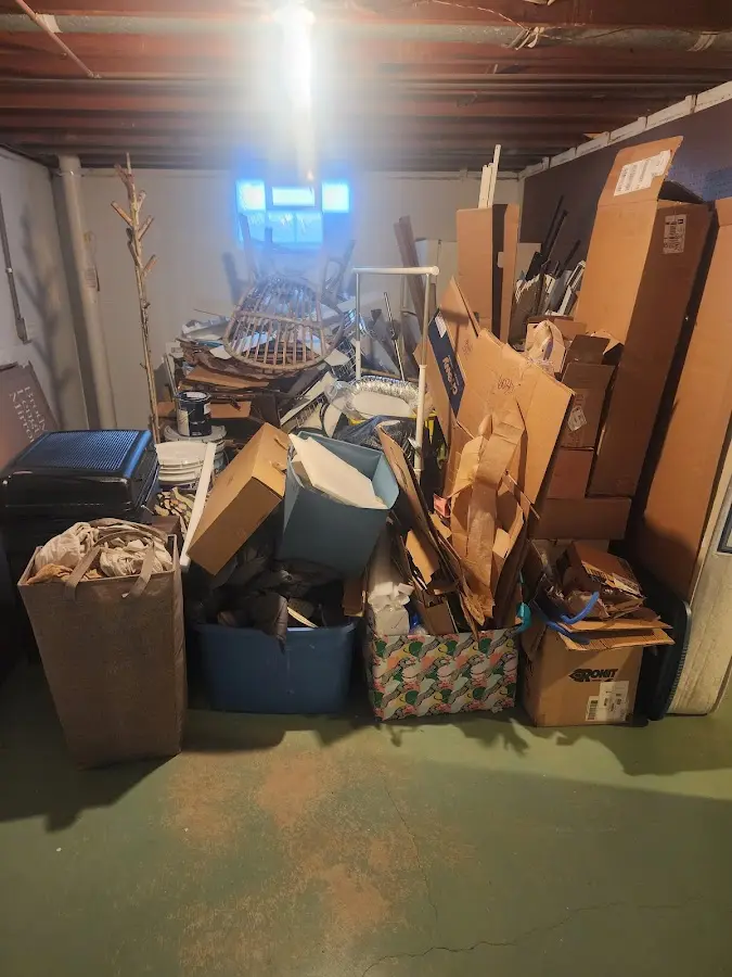 Roll-off dumpster container at job site for 8 Yard Dumpster Rental in Northwoods